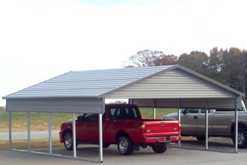 Carport with a quarter wall, wide gable, and a boxed eave. 