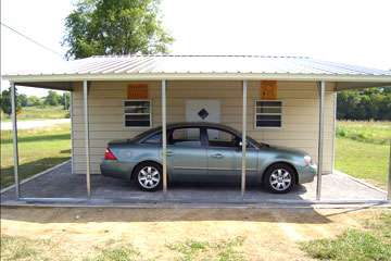 Metal sheds with large enclosed structure containing windows and a door